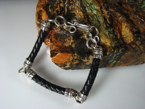 Sterling silver and braided leather unisex bracelet.