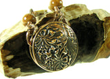 Handmade Solid Bronze 2 sided Pendant with wire wrapped Mother of Pearl Carvings