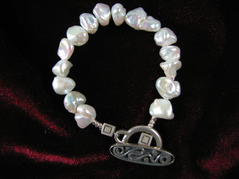 White baroque Keshi pearl bracelet w/ silver clasp.
