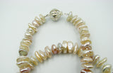 Natural color Eighteen inch Beautiful Keshi Pearl Necklace with sterling silver clasp.